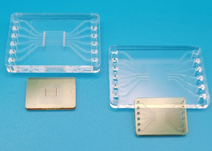 Machined polymer components with microfluidic features